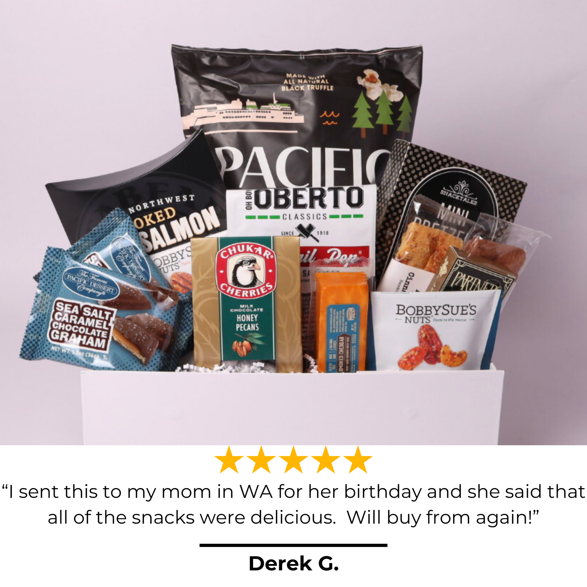 Top-rated snack gift box featuring artisan popcorn, nuts, chocolates, and more, tied with a navy blue satin bow. A five-star customer favorite for corporate gifting, birthdays, and special occasions.