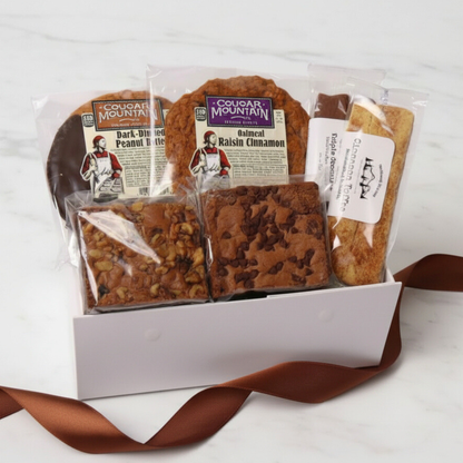 A delicious Pacific northwest Bakery gift Box featuring Northwest Biscotti, Cougar Mountain cookies, and Lydia’s Cakes & Confections brownies—perfect for a thank you gift, foodie gift, or corporate client treat.