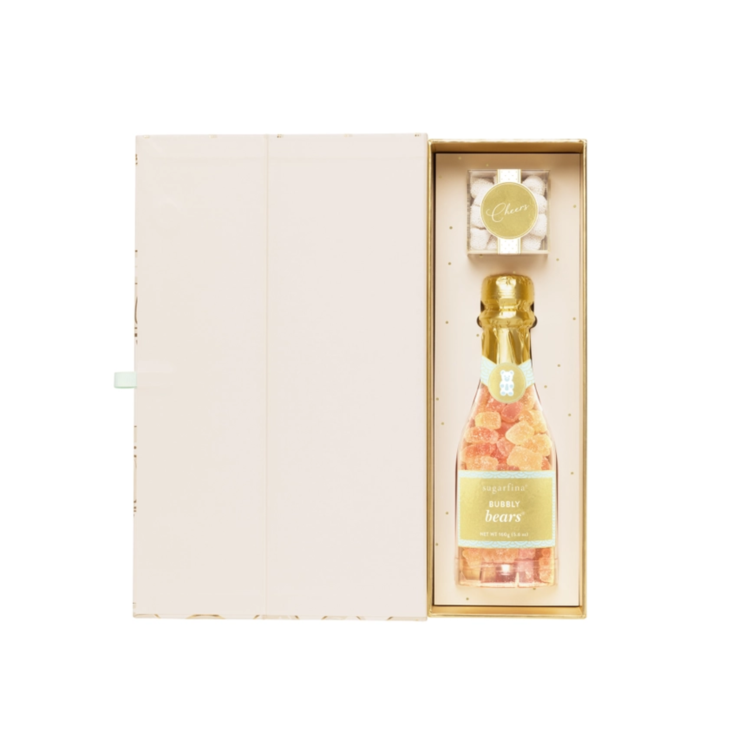 Side view of Sugarfina gift box partially open, revealing champagne bottle-shaped gummy candy inside decorative packaging.
