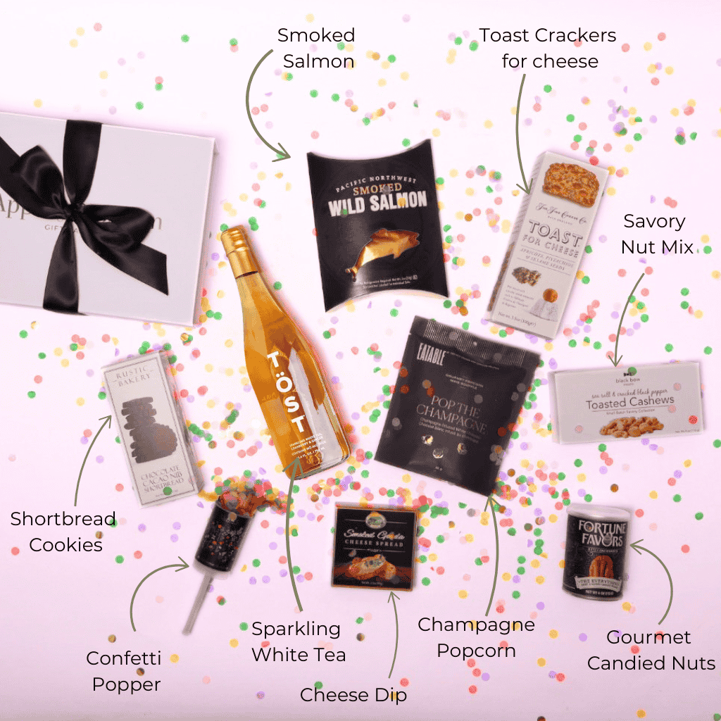 A beautifully arranged flat lay of our premium white tea and gourmet gift set, including cheese, pacific northwest smoked salmon, and chocolates—an elegant gift for birthdays, anniversaries, and celebrations.