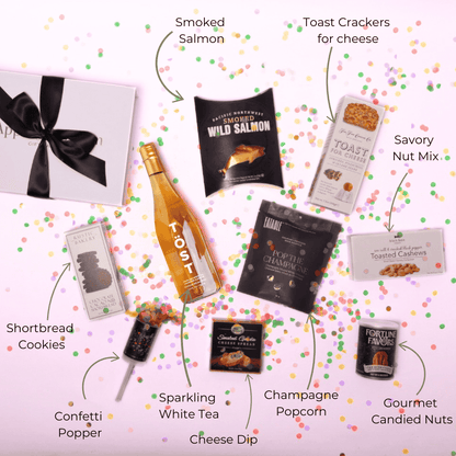 A beautifully arranged flat lay of our premium white tea and gourmet gift set, including cheese, pacific northwest smoked salmon, and chocolates—an elegant gift for birthdays, anniversaries, and celebrations.