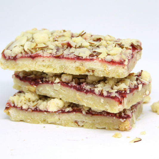 Individually wrapped Raspberry Jammer Bar made by Seattle’s Favorite with raspberry jam and oat crumble, perfect for gift baskets.