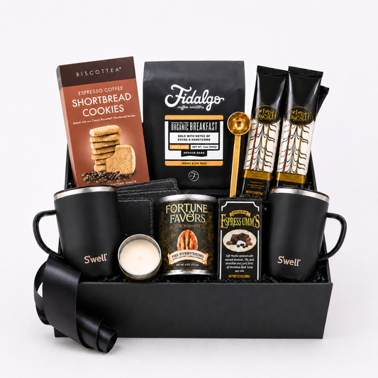 The Regal Seattle Coffee gift box in black signature packaging, filled with premium coffee essentials including double-walled ceramic mugs, Fidalgo organic coffee, and gourmet treats.