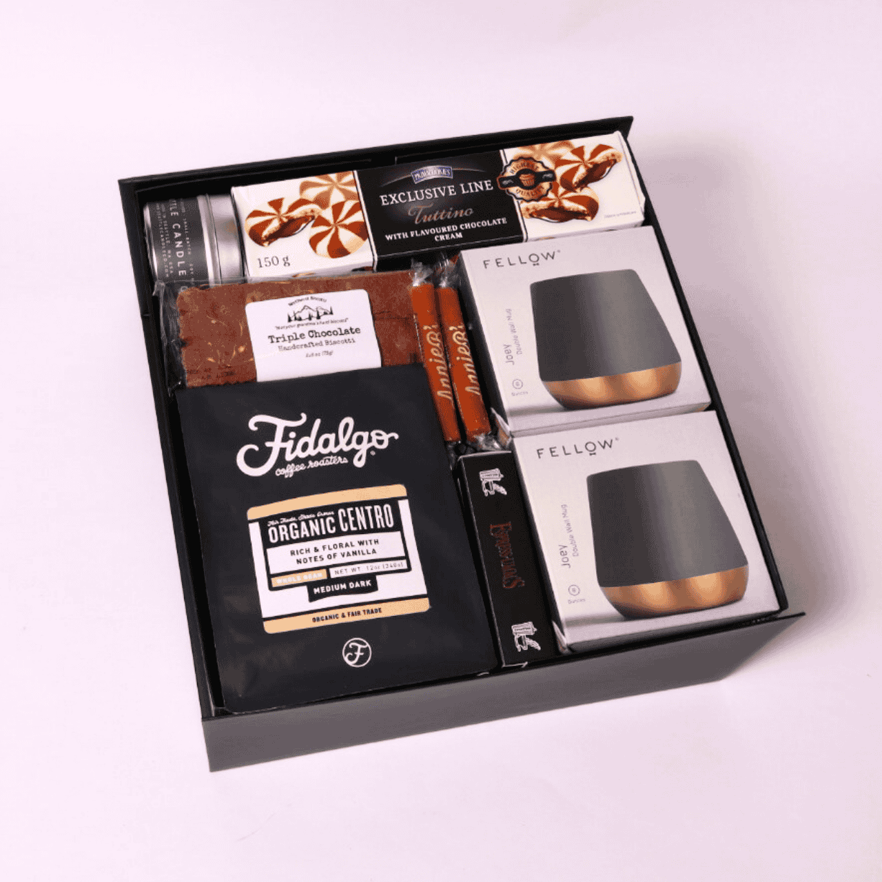 Elegant coffee gift set with ceramic mugs, espresso caramels, chocolate sauce, cookies, and a Coffee & Cream candle—ideal for coffee lovers.