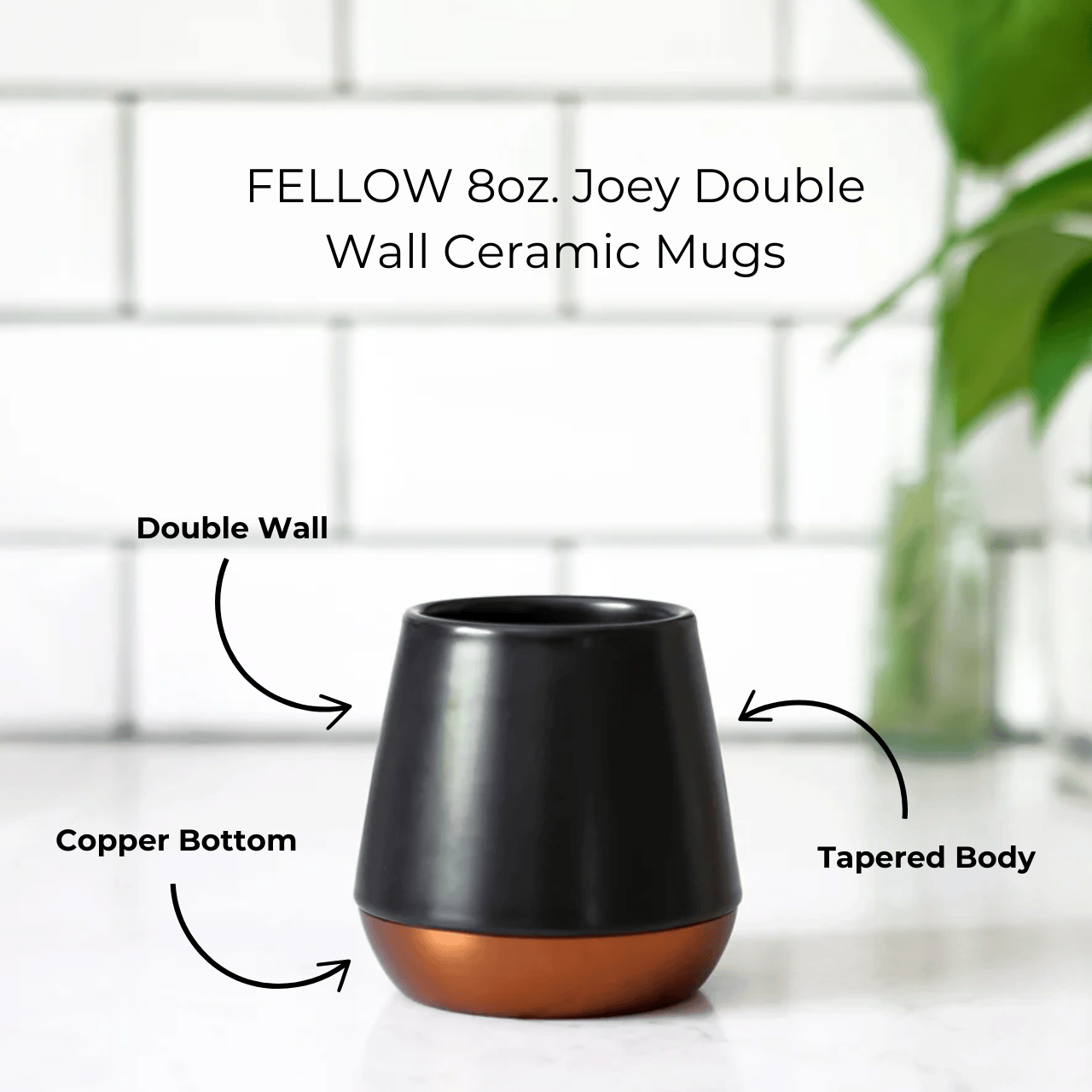 Double-walled Fellow ceramic mug in sleek design, perfect for enjoying hot beverages while keeping hands cool, showcasing its elegant craftsmanship.