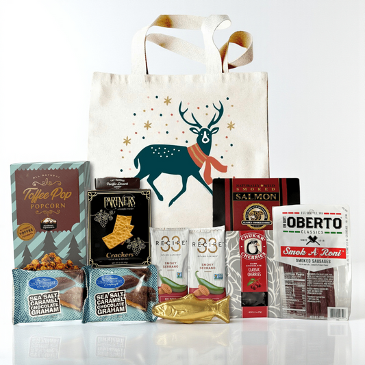 Assorted snacks and a tote bag made in Washington with a deer design on a white background