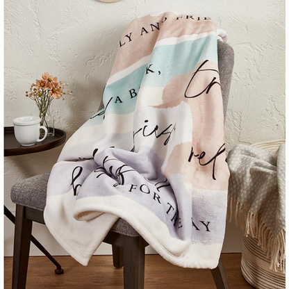 Soft Retirement Rules Throw Blanket draped on a chair with cozy home décor. Perfect retirement gift, inspirational sayings, and PNW gift basket addition.