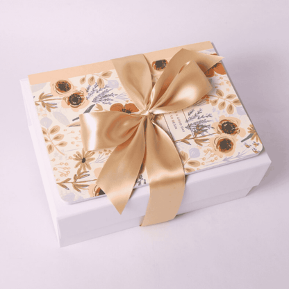 Rose Garden Gift Box with Journal on Top – A beautifully wrapped gift box featuring a floral journal tied with a satin bow, creating an elegant and thoughtful presentation.
