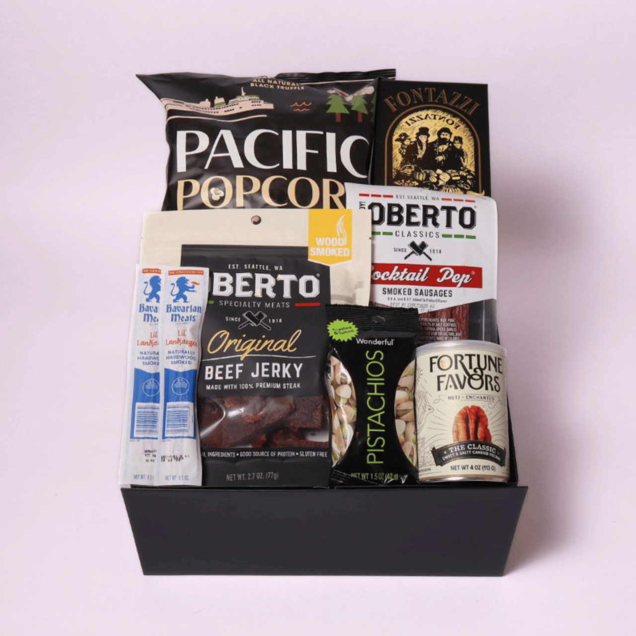 Oberto snack gift box featuring beef jerky, smoked sticks, and truffle popcorn from Washington, a unique treat for the hard-to-buy-for man in your life