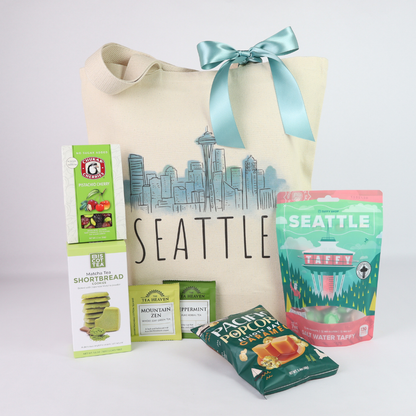 Seattle tote gift set with local snacks, tea, cookies, taffy, caramel popcorn, and reusable skyline tote bag.