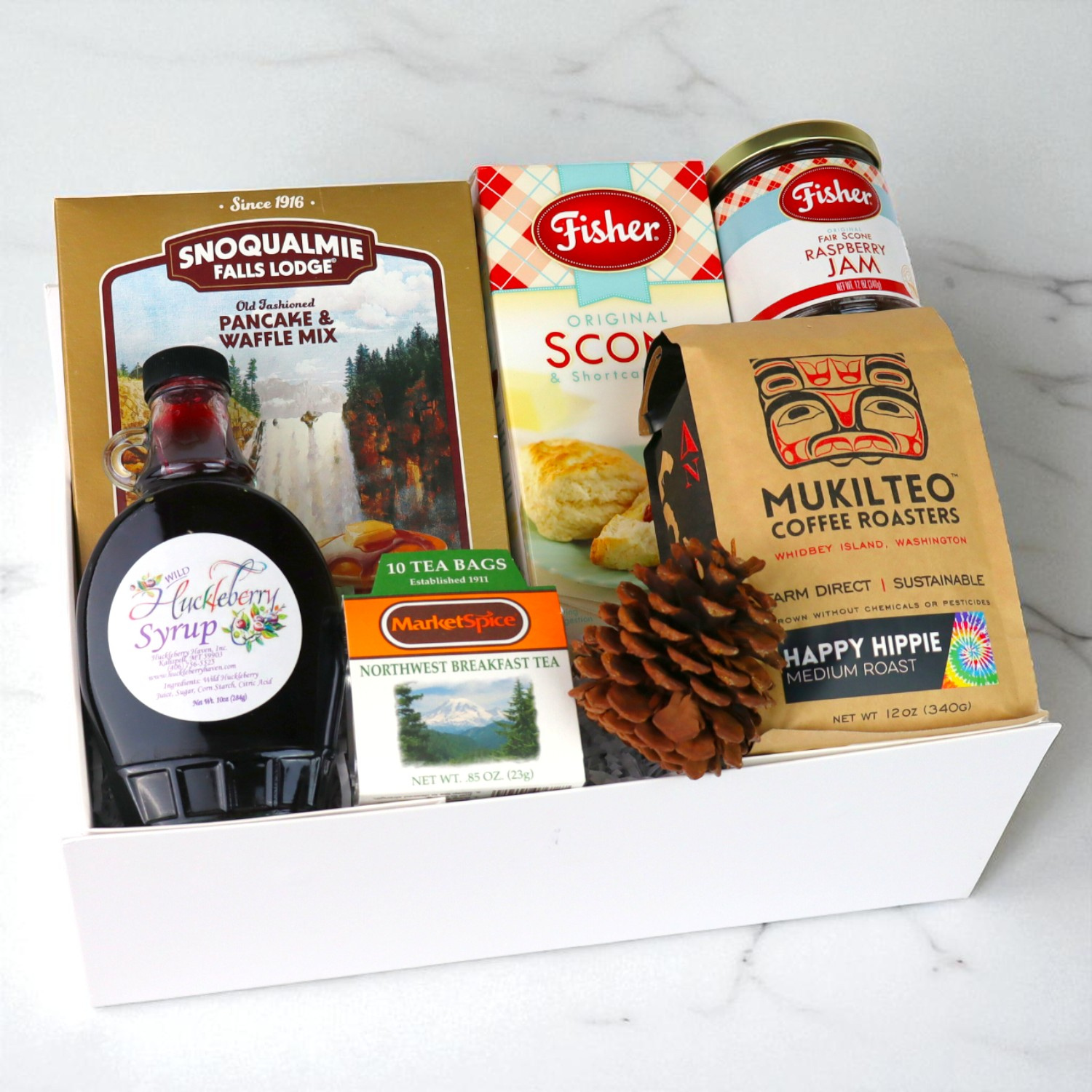 Pacific Northwest breakfast gift set with Seattle tea, pancake mix, hazelnut spread, jam, and nuts arranged neatly for gifting