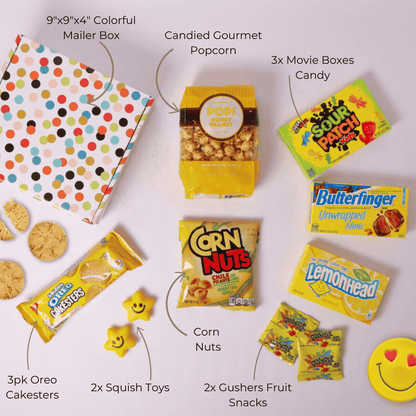 Flat Lay of Smiles and Sunshine Gift Box – A vibrant assortment of sweet and savory snacks, perfect for a snack gift basket, care package, or happy pick-me-up gift.