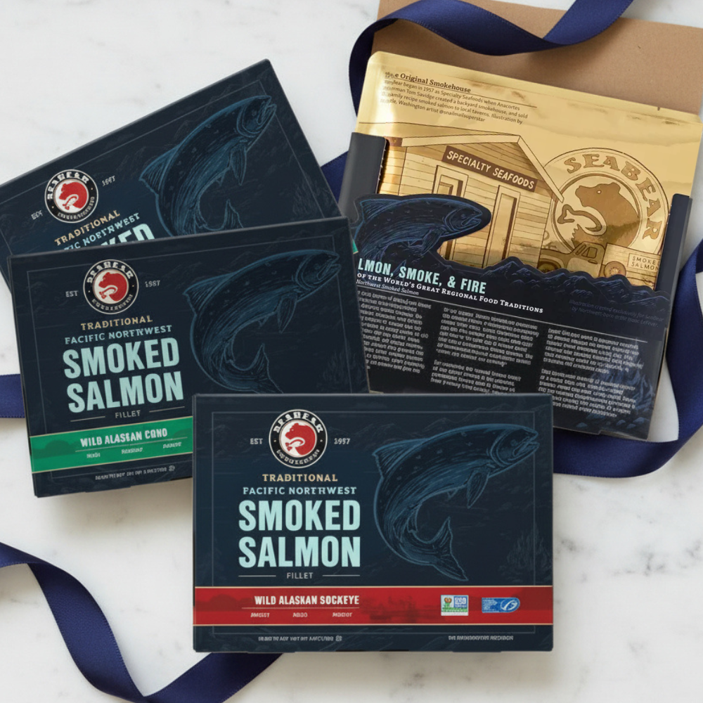 Collection of seabear smoked salmon gift set packages with branding on a marble surface