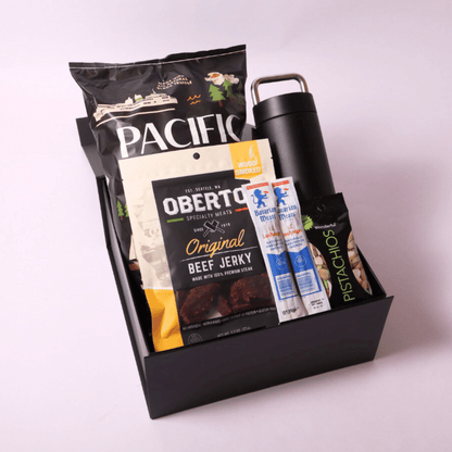 Premium snack and hydrate gift box with a luxury water bottle, beef jerky, smoked beef sticks, pistachios, and truffle popcorn for a unique gift experience