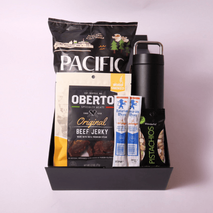 Snack and Hydrate Gift Box featuring Fellow 20oz water bottle, gourmet beef jerky, Bavarian smoked sticks, pistachios, and truffle popcorn – perfect for him.
