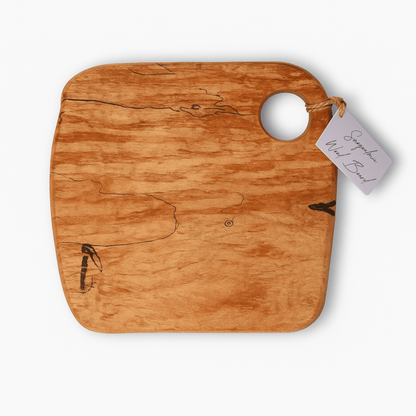 Handcrafted charcuterie board made in Washington, milled and kiln-dried from salvaged Snoqualmie Valley logs, finished with food-safe oil and wax.