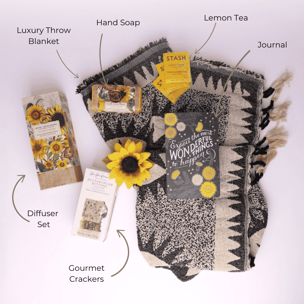 Flat Lay of All Products:
“Flat lay of sunflower gift set from Seattle gift basket company including blanket, herbal teas, journal, soap, diffuser, and crackers—local, curated, cozy.”