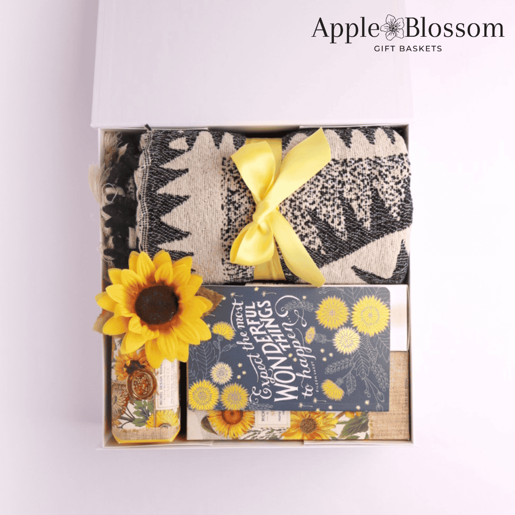 Gift Box Lid Open with Products Packed Inside:
“Beautifully packed Pacific Northwest gift box with luxurious throw, artisan tea, and local goods—ideal for birthdays, retirement, or sympathy gifts.”