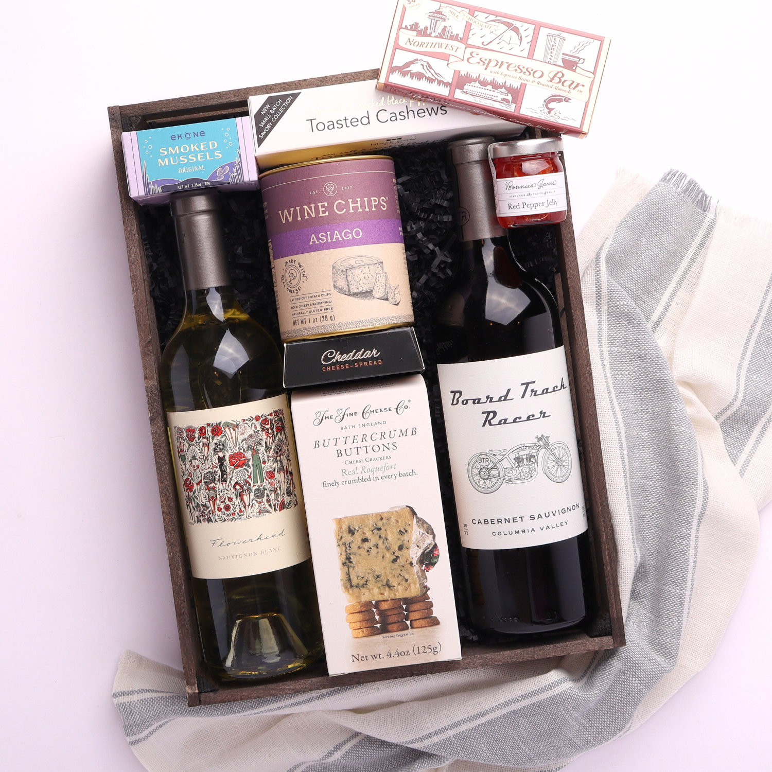 made in Washington wine and snack tray in a wooden tray the high end gift includes pinot gris, cabernet sauvignon, crackers, cheese, smoked muscles, wine chips,  and other snacks