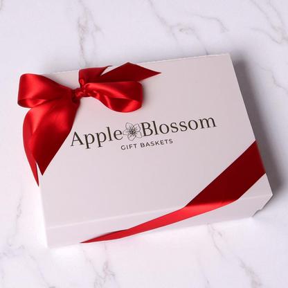 white apple blossom gift baskets signature luxe gift box with a satin red bow.
