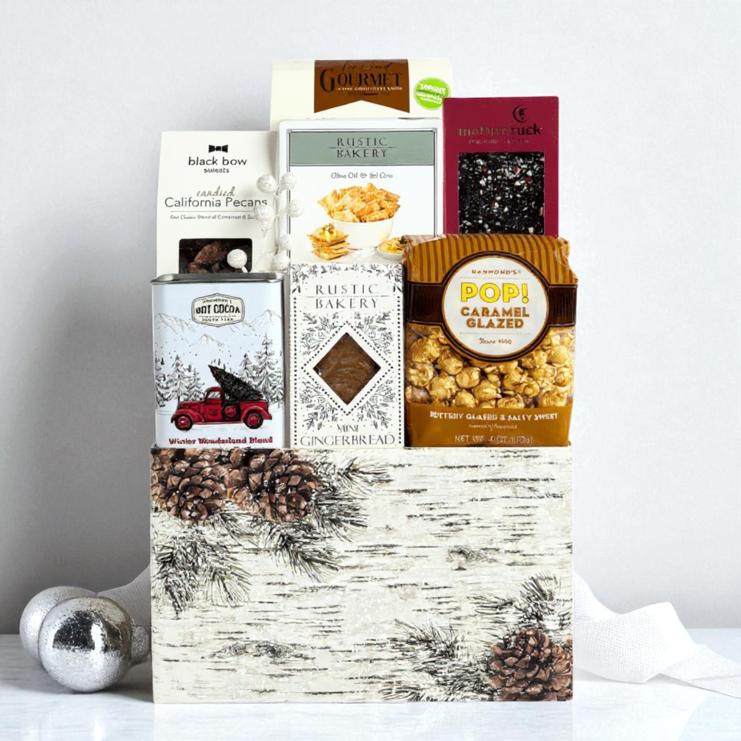 winter wonderland corporate gift basket filled with popcorn, crackers, chocolate, nuts and gourmet snacks made in Washington