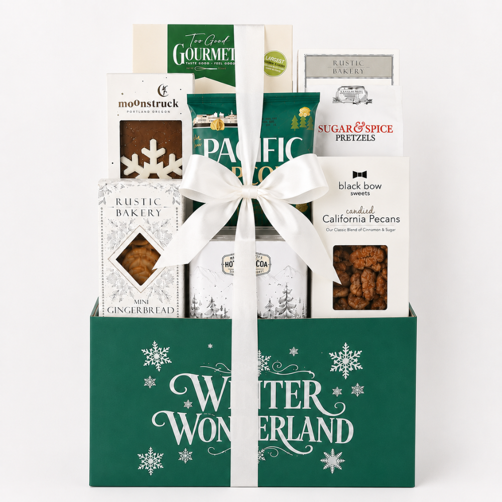 A gift basket of assorted snacks and treats wrapped in a white ribbon, presented in a green box with 'Winter Wonderland' printed on the front. Visible brands include mo99nstruck, Pacific Bakery, Sugar & Spice, Rustic Bakery, and black bow sweets.